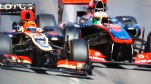Kimi Raikkonen, Lotus and Sergio Perez, McLaren bang wheels at Monaco.